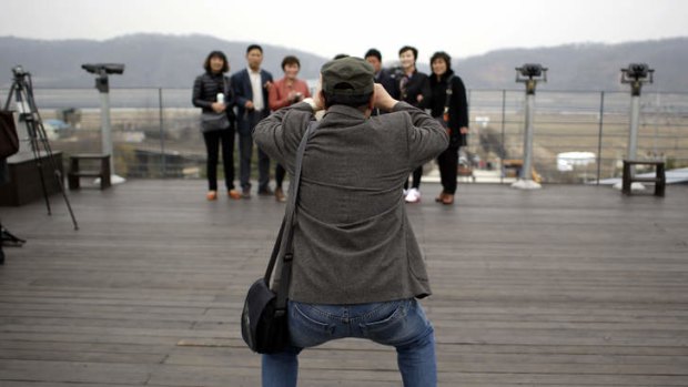 Chinese tourists take pictures at the Imjingak Pavilion near the border village of Panmunjom, dividing the two Koreas.