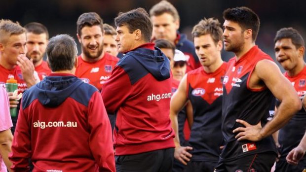 Paul Roos has a word with his players during a break.