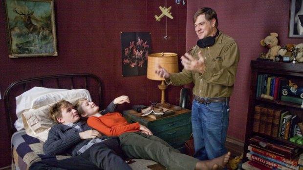 (From left) Henry Hopper and Mia Wasikowska listen to the wisdom of director Gus van Sant on the set of <i>Restless</i>.