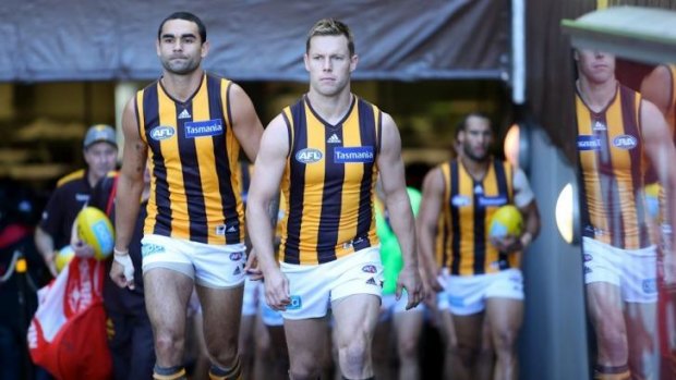 Shaun Burgoyne and Sam Mitchell lead the Hawks out for the round seven game against St Kilda on Saturday, the 250th game for both.