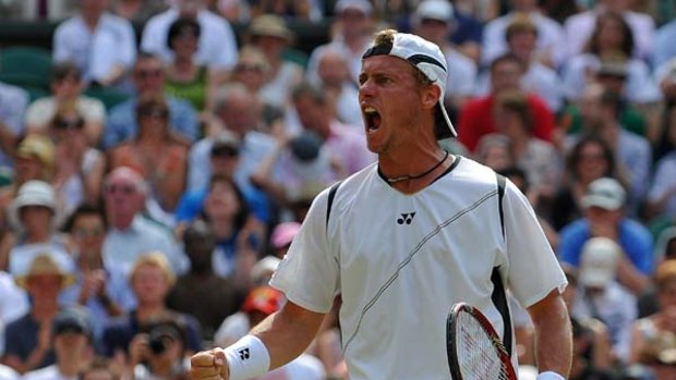 ''I can give Djokovic a run for his money'' ... Lleyton Hewitt in his straight-sets win over France's Gael Monfils at Wimbledon on Friday.