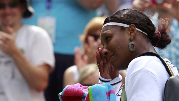 Serena Williams breaks down after winning through to the second round.