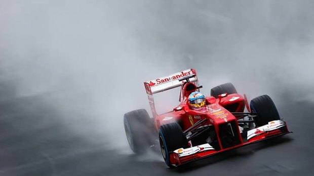 The rain in Spain? .... Ferrari's Fernando Alonso during the eventful qualifying period.