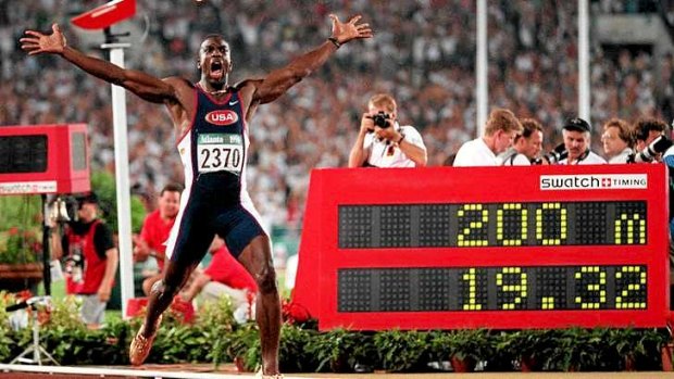Record: Michael Johnson celebrates winning the 200m final in a world record time of 19.32s at the 1996 Olympic Games in Atlanta.