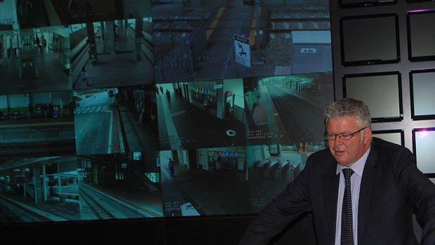 Transport Minister Troy Buswell gets a first-hand look at the "Big Brother" facilities and 32 screens of Transperth's new central monitoring room.