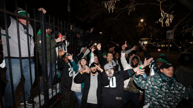 Over the moon: Eagles fans celebrate after their win over the Vikings.
