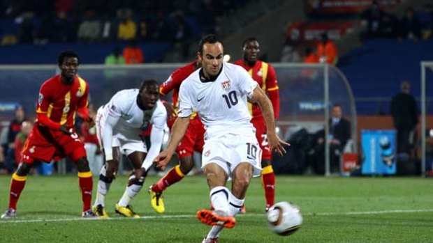 Landon Donovan of the United States scores from the penalty spot against Ghana in the 2-1 defeat.