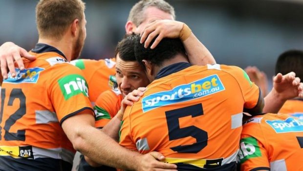 Together: Knights players embrace after a try on Sunday.