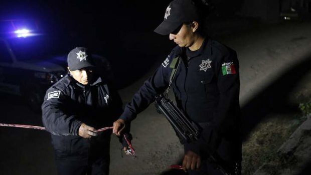 Deadly cargo found ... Police secure the area after dangerous radioactive medical material was located near a stolen truck in the town of Hueypoxtla, Mexico.