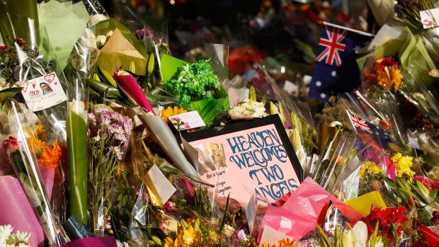 Flowers and messages left outside the  Lindt Cafe in Sydney.