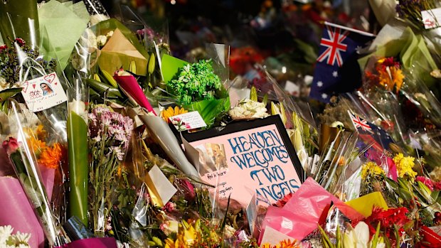 Flowers and messages left outside the  Lindt Cafe in Sydney.