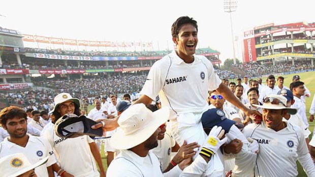 Delhi, November 2, 2008 ... teammates chair Anil Kumble around the pitch after he announced his retirement from Test cricket.