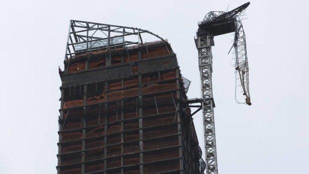 A construction crane dangles precariously over a street in New York during last month's storm.