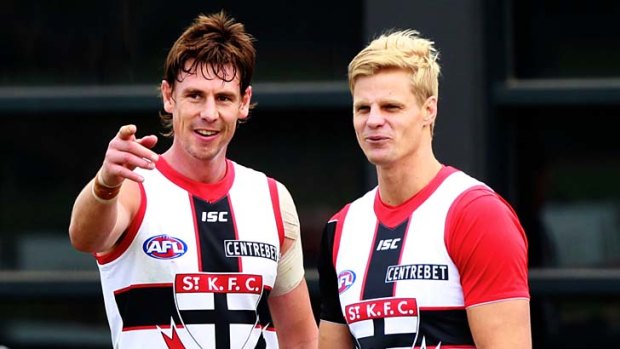 Justin Koschitzke and Nick Riewoldt during a training session.