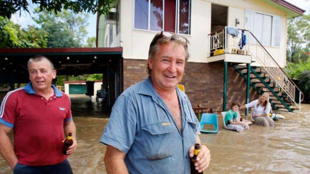 Making the best of it ... David Byrne, Max Wood, Dean Walsh and Deanna Walsh at Max and Deanna's home in Rockhampton yesterday.