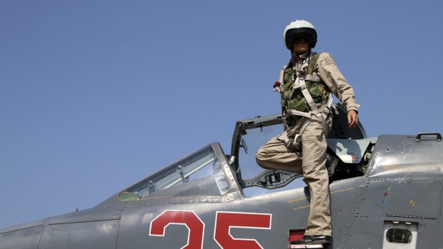A Russian army pilot in the cockpit of a jet fighter at Hmeimim airbase in Syria. 