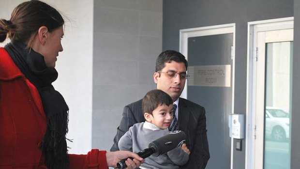 Royal Perth Hospital endocrinologist Suhail Ahmed Khan Durani, 35, outside court with his son following his guilty verdict.