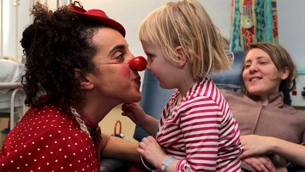 The best medicine ... clown doctor Avital Dvory entertains Freyja Marchand.