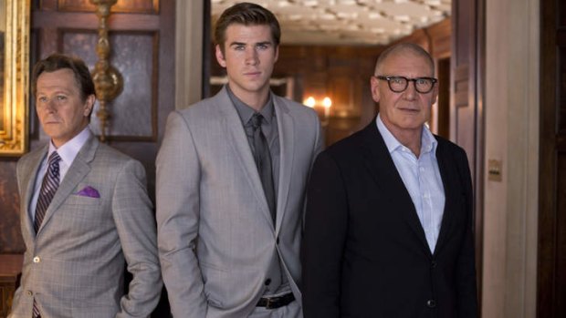 Paranoia stars (from left) Gary Oldman, Liam Hemsworth and Harrison Ford.