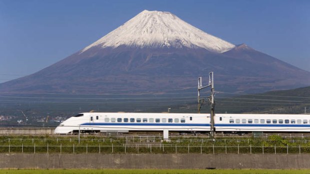 Thrilling ... a bullet train passes Mount Fuji, "that perfect volcano".
