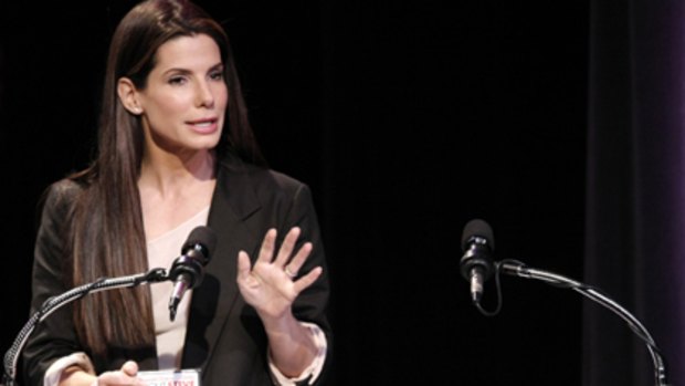 Actress Sandra Bullock accepts her Razzie award for worst actress in a feature film.