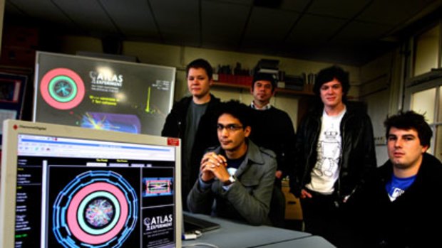Smashing time ... from left, Ian Watson, Nik Patel, Dr Aldo Saavedra, Mark Scarcella and Cameron Cuthbert, physicists at the University of Sydney who are working on particle collisions from the Large Hadron Collider.