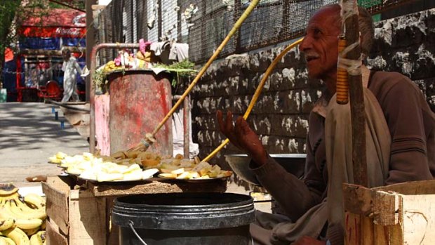 Hope rather than expectation: Pakistani roadside fruit vendor Gufoor Ahmad.