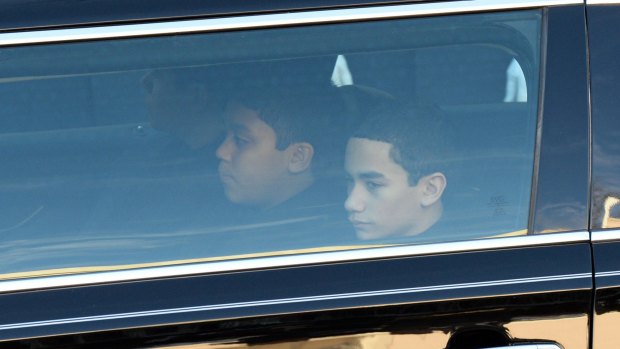 Ramos' sons arrive for the funeral of their father, an NYPD officer gunned down in New York five days before Christmas. 