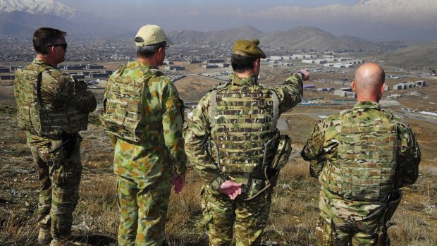 (From left) Australian Commander in Afghanistan Brigadier Michael Mahy, Chief of Joint Operations Lieutenant General Ash Power, Brigadier Bruce Russell and Commander Joint Task Force 633 Major General Craig Orme view key points around Camp Qargha.