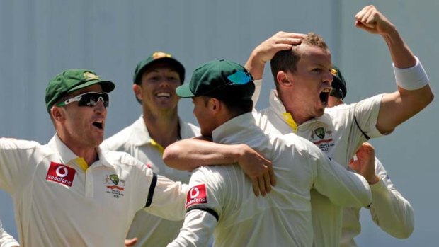 Master blaster &#8230; Peter Siddle leads the Australian team's celebrations after dismissing India's danger man Sachin Tendulkar for the second time in the match.