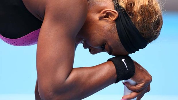 Down and out: Serena Williams  in her fourth round match against Ana Ivanovic of Serbia.