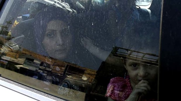 Escape &#8230; a Syrian family arrives at the border with Lebanon. As many as 30,000 Syrians have fled in the past 48 hours.