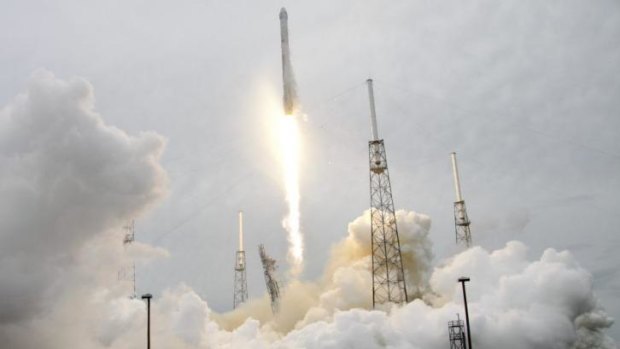 A rocket carrying the SpaceX Dragon ship lifts off from launch complex 40 at the Cape Canaveral Air Force Station in Cape Canaveral, Florida.