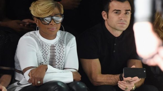 Jennifer Aniston's fiance Justin Theroux enjoying the front row at the Alexander Wang for H&M show with singer Mary J. Blige.