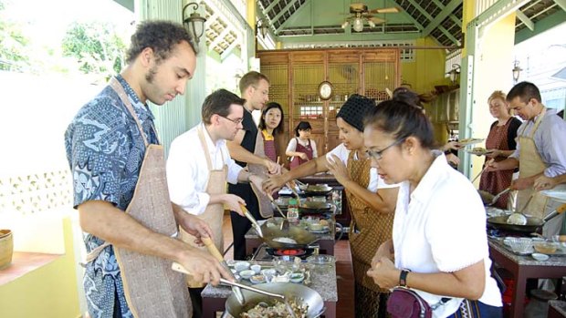 Spice of life ... Tam checks the wok at Amita Thai Cooking Class.