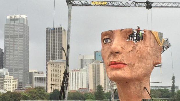 Epic: Opera Australia's 18-metre <i>Aida</i> sculpture is craned into position on Sydney Harbour.
