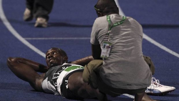 Usain Bolt receives a massage on the track.
