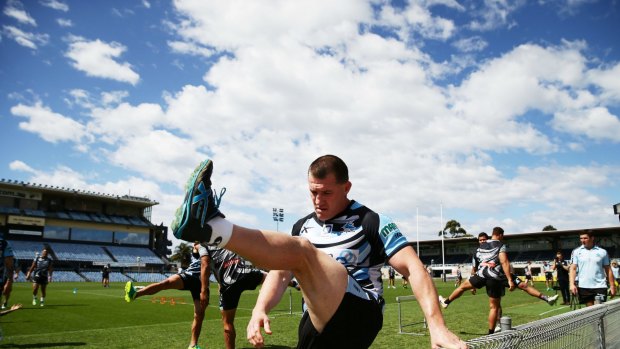 No more clouds: Paul Gallen stretches during  Sharks training session.