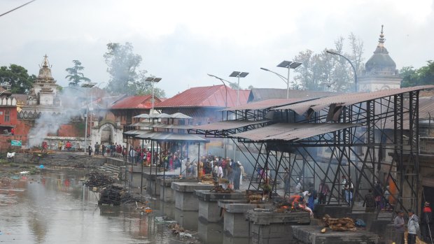 Funeral pyres are burning 24 hours a day along the Bagmati River near Kathmandu's ancient Pasupatinath Temple.