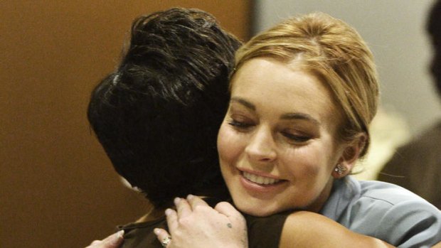 Lindsay Lohan hugs her attorney Shawn Holley after the hearing.