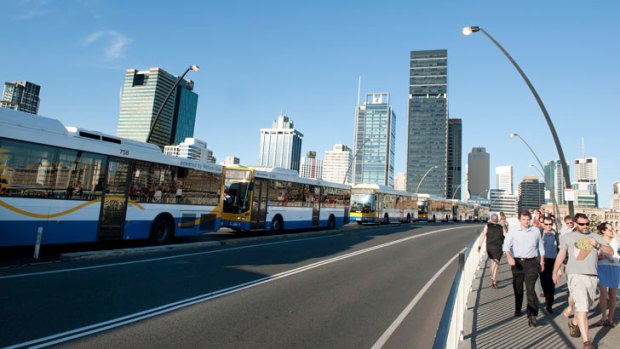 Buses line up across the Victoria Bridge during peak hour in Brisbane.