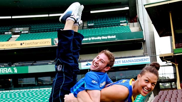Olympic gold medal-winning diver Matthew Mitcham gets a lift from Liz Cambage.
