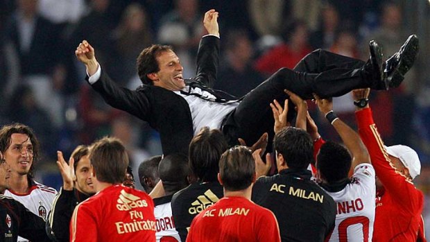 Coach Massimiliano Allegri is tossed into the air by his players.