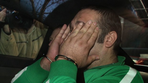 Angelo Venditti being driven into Melbourne Magistrates Court by detectives from Purana taskforce.