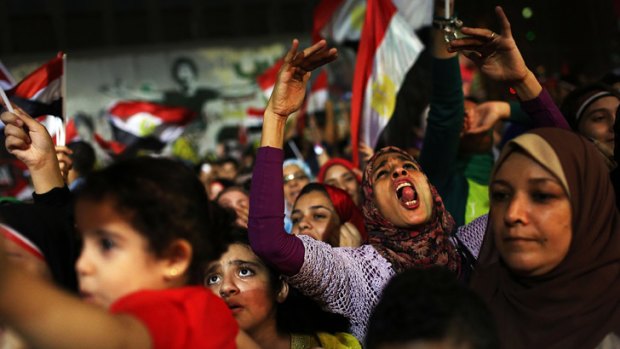 People dance and cheer in Cairo's Tahrir Square after  Egyptian President Mohammed Mursi was ousted last week.