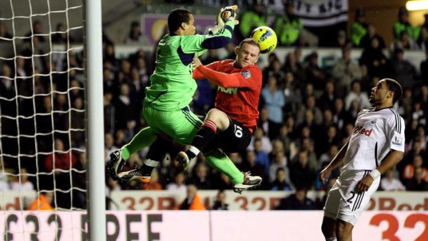 Vorm welcome &#8230; Swansea keeper Michel Vorm foils Wayne Rooney.