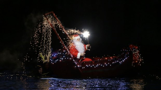 He gets around ... Santa Claus spotted in a boat in Imperia, near Genoa, Italy.