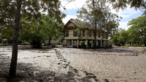 Silt and mud surrounds a home on Short Street, Laidley, where flood waters have devastated the town.