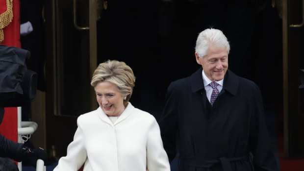Hillary Clinton (with President Bill Clinton) helped cement white as the colour of unity and feminism.