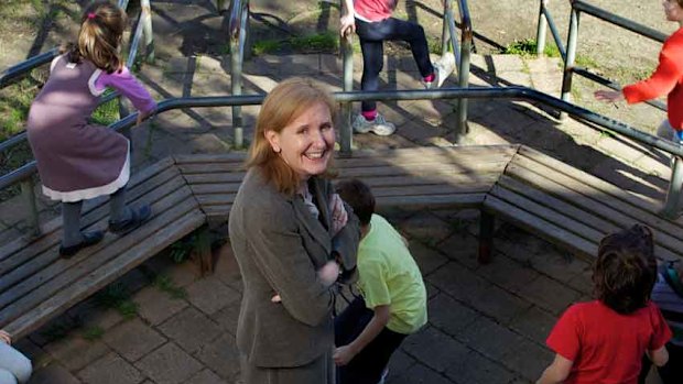 Princes Hill principal Esme Capp with pupils playing Cat and Mouse.